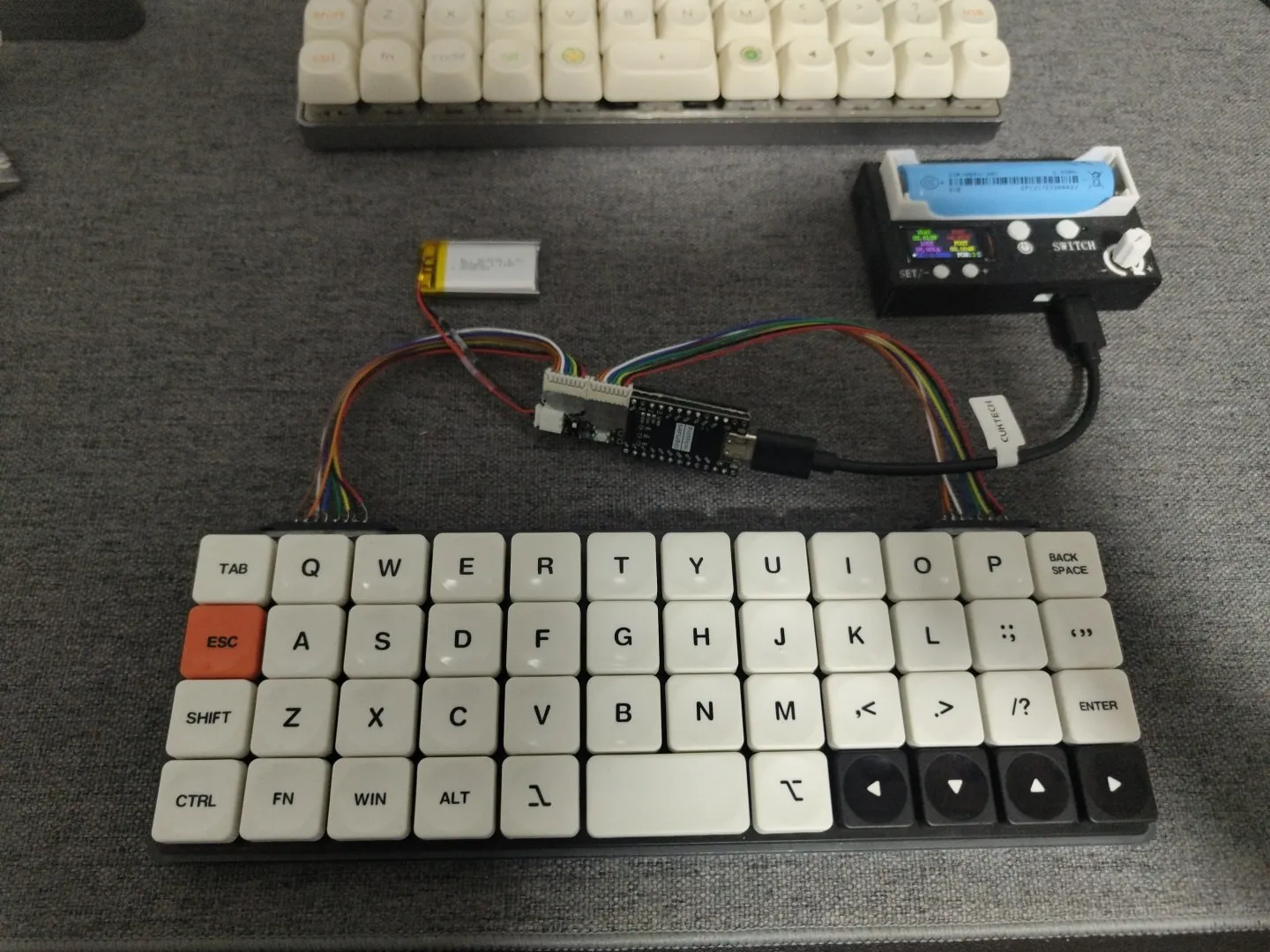 The finished POC — handwired Planck with the controller bar attached